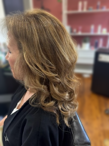 Finished clip-in hair extensions style with curls at LaRoc Salon in Phoenix, AZ